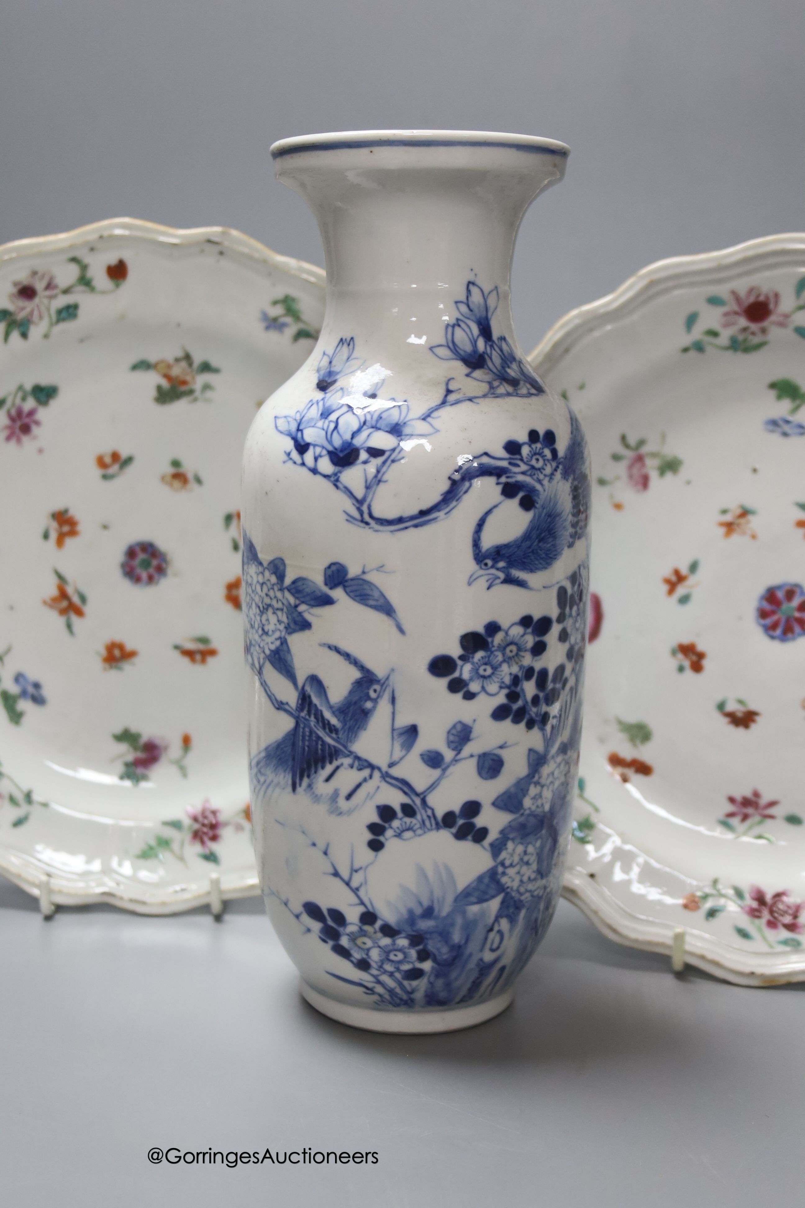 A Chinese late 19th century blue and white vase, height 25.5cm, a pair of 18th century Chinese export famille rose plates and a blue and white tea bowl